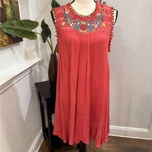Women’s size Small trapeze dress by Umgee. Coral with floral embroidery.